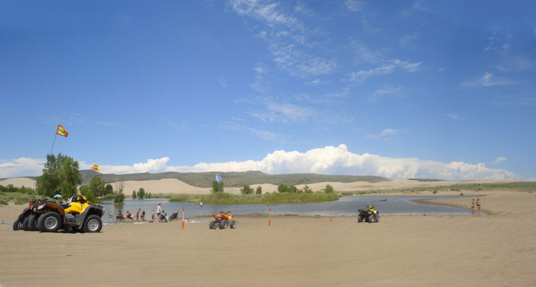 4-wheelers at Sand Dunes near the water.