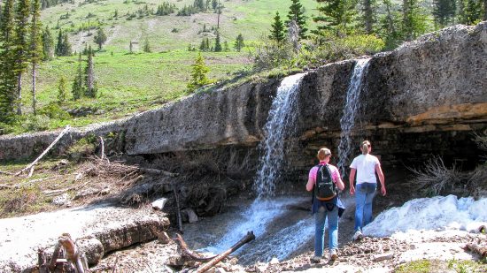 Climb behind a waterfall downstream from the cave. - Caves around rexburg