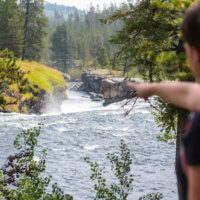 Women pointing to sheep falls